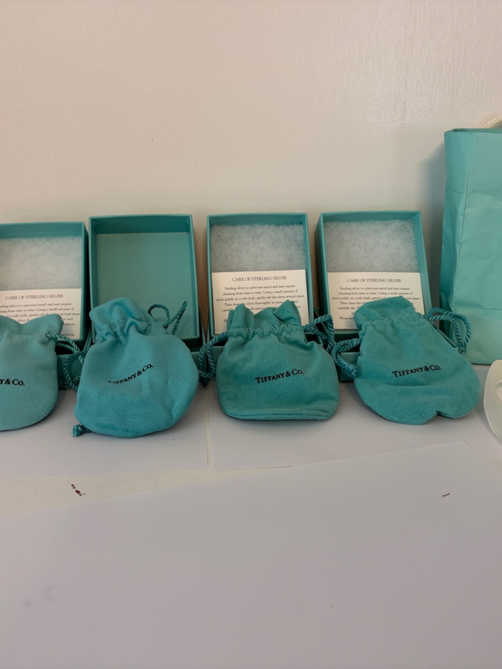 Bundle of 5 Tiffany boxes, pouches, one bag and one ribbon.